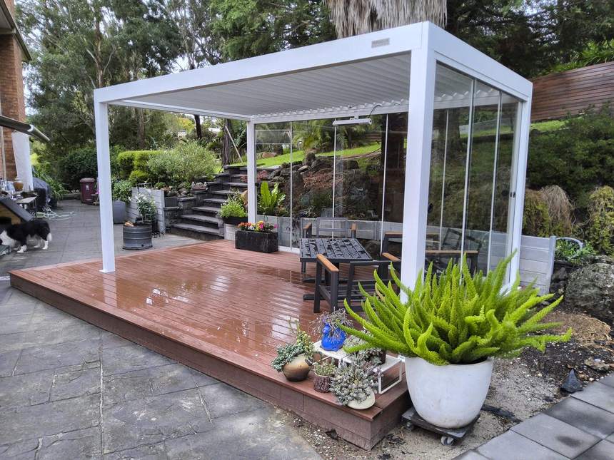 Completed outdoor transformation at Templestowe — herringbone composite deck, Pergolux louvred pergola and glass walls